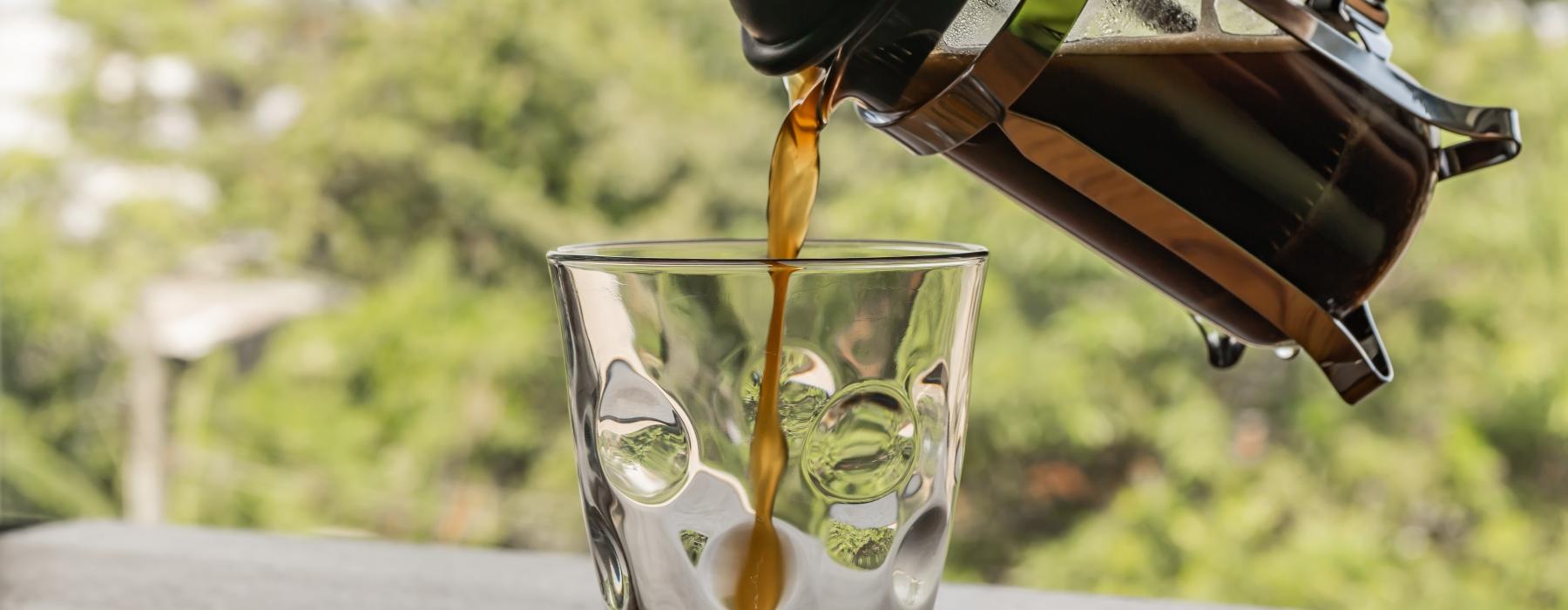 Coffee being poured into a glass