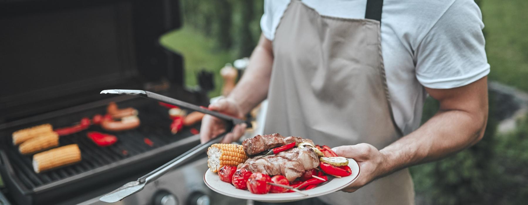 a man holding a plate of food